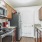 a kitchen with wooden cabinets