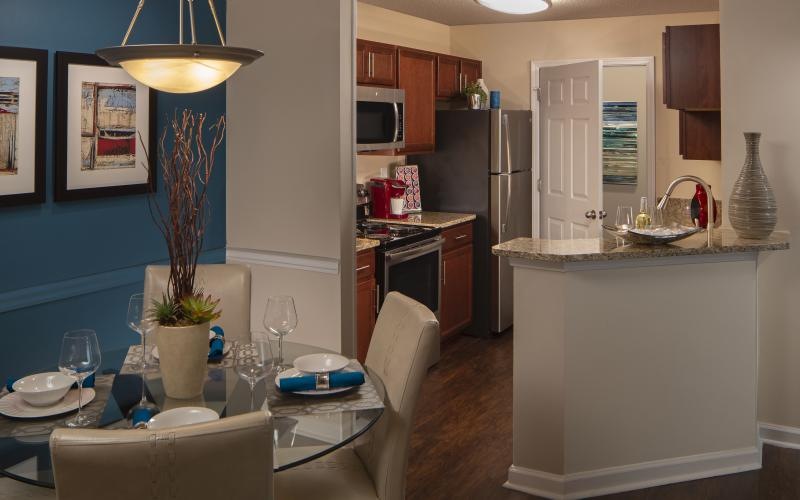 a kitchen with a table and chairs