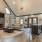 a clubhouse with a fireplace tv seating and kitchen