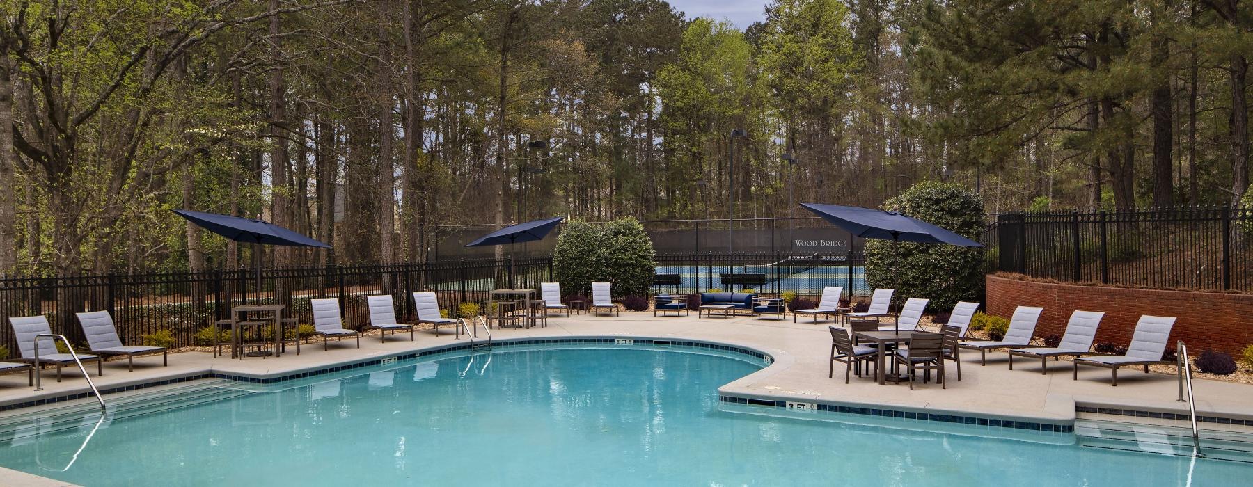a pool with chairs around it