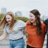 friends laughing together outside