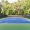 a tennis court with trees in the background