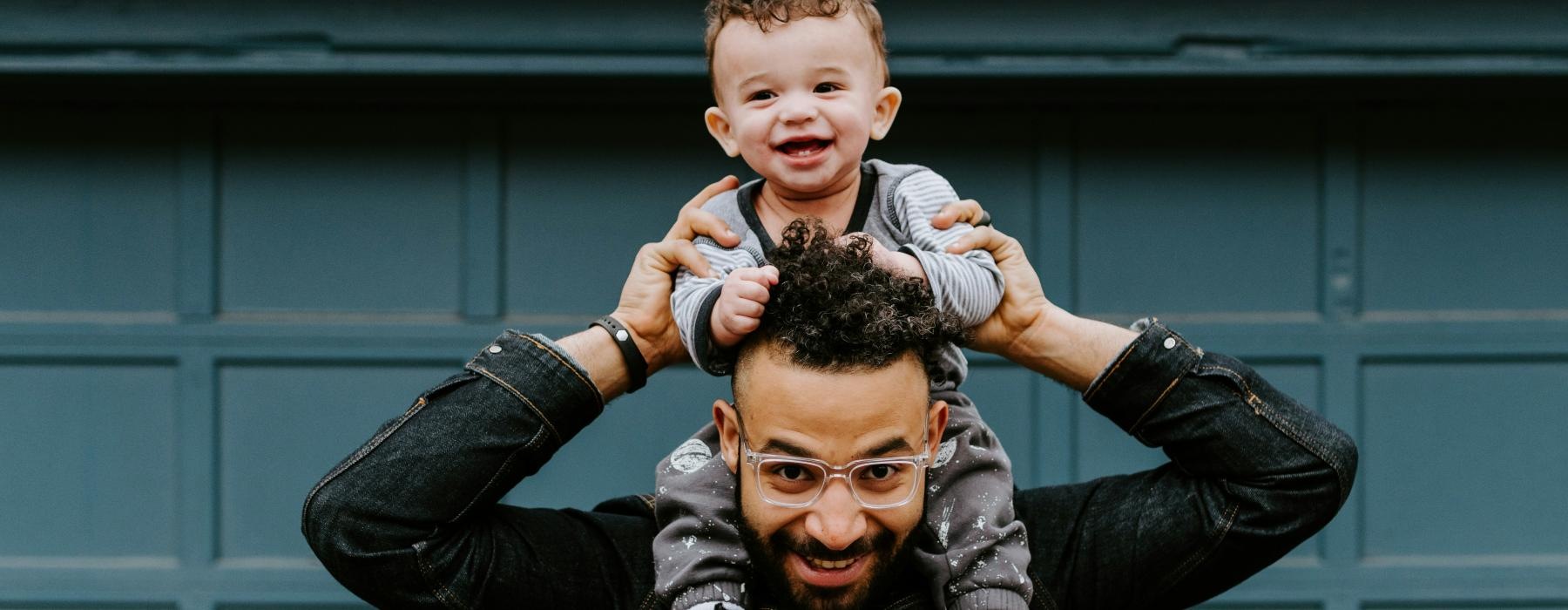 a man holding a child