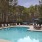 a pool with chairs around it