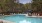 a pool with chairs around it